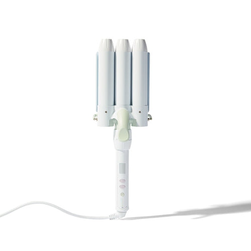 A white triple-cylinder curling iron with three curved barrels, a light green center button, and a white power cord, shown on a clean white background with a soft shadow.