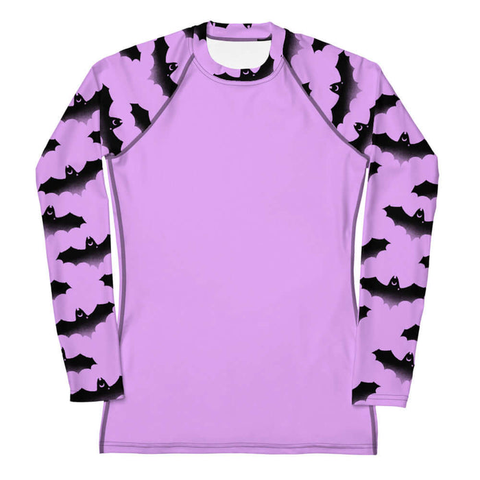 Aensland pastel-goth rash guard in pink with watercolor bats and drifting clouds