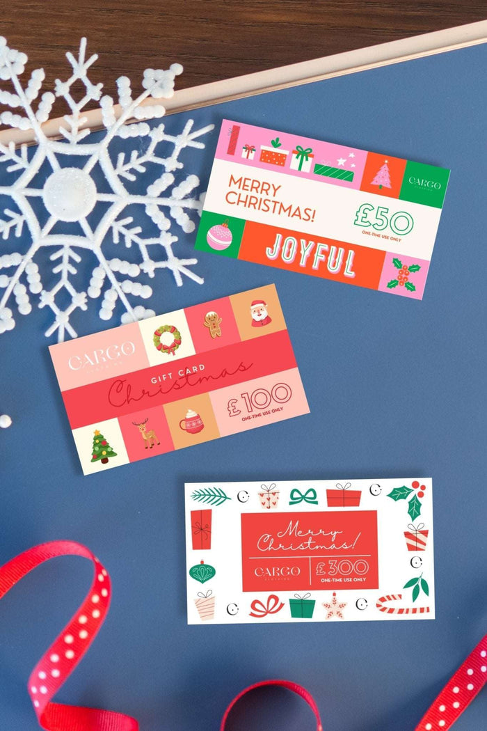 Cargo Clothing Gift Card in festive Christmas designs, available in £50, £100, and £300 values. Buy online or in-store, valid through 2026.