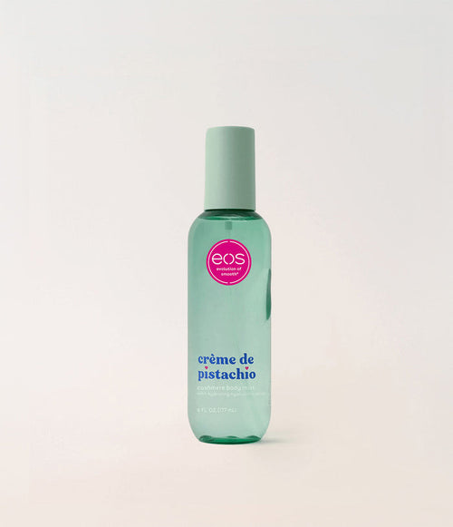 Green bottle of eos crème de pistachio on a light gray background
