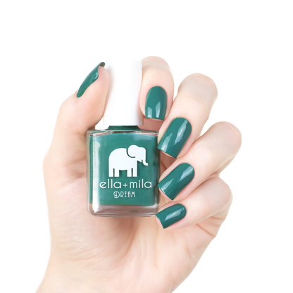 Daydreamer viridian green nail polish manicure on a light skin tone with the bottle