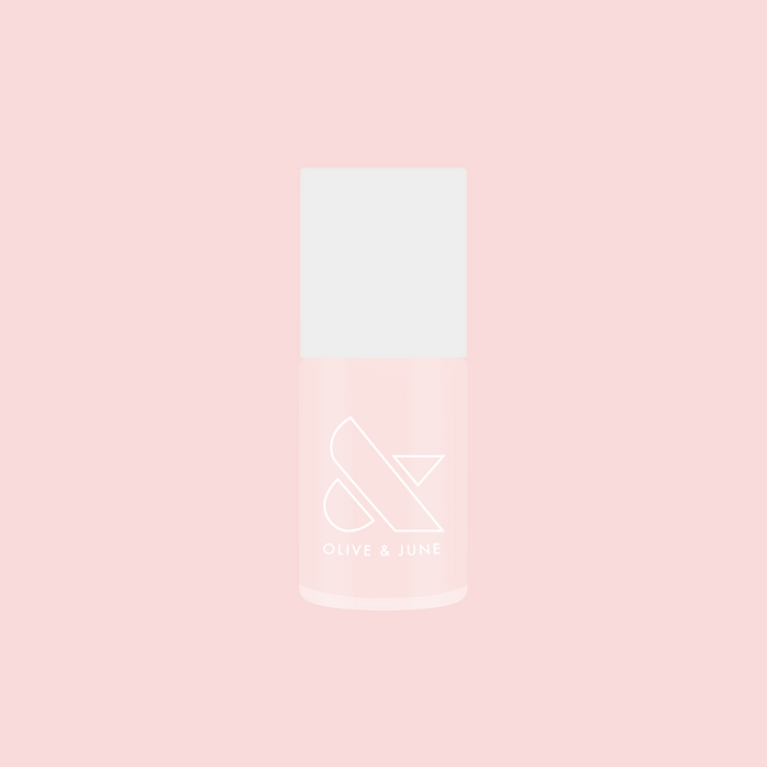 Bottle of FIRST DATE nail polish in soft milky strawberry pink with subtle silver shimmer on a pink background
