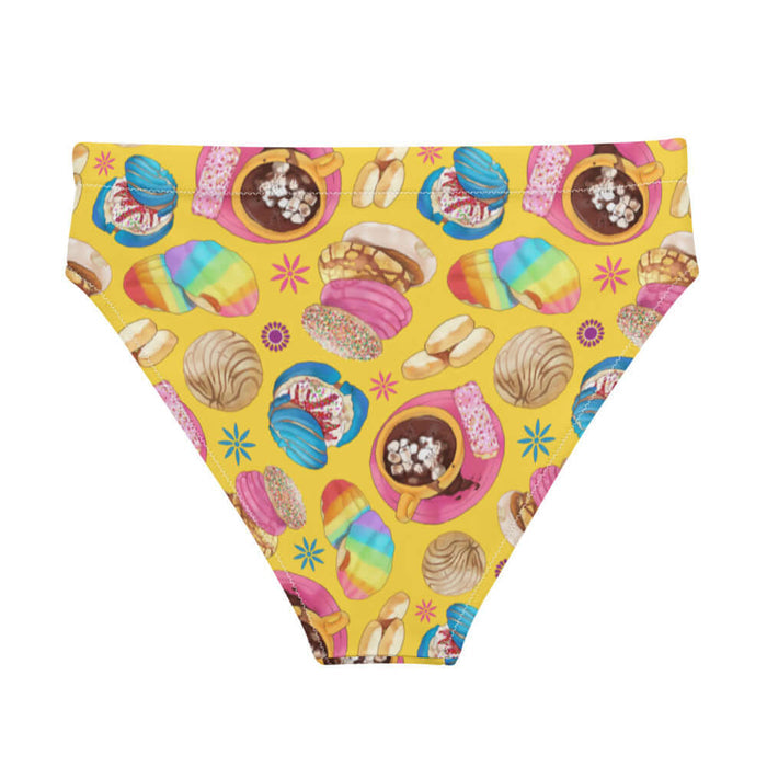 Pan Dulce kawaii high-waisted bikini bottom in yellow with rainbow-striped conchas and blue drizzled conchas