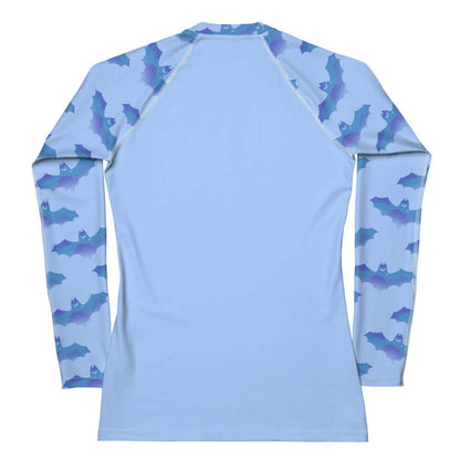 Lilith pastel-goth rash guard in blue with bat print and pastel clouds
