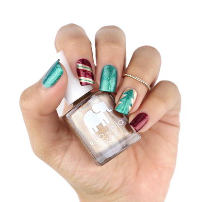 Mirage gold accent nails with teal and red candy-cane holiday nail art