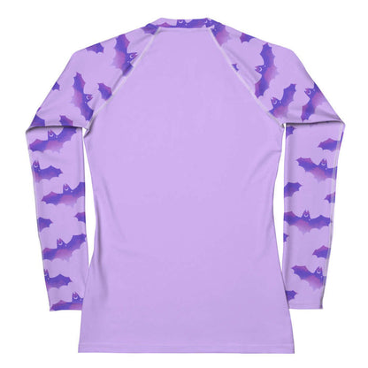 Morrigan pastel-goth rash guard in lavender with bat print and pastel clouds