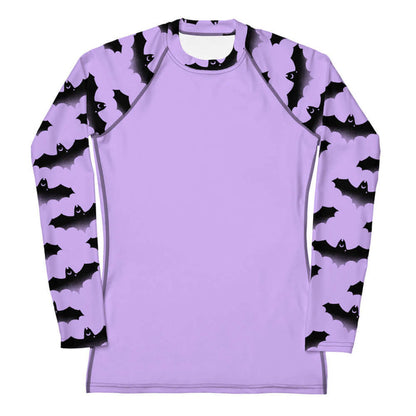 Morrigan pastel-goth rash guard in lavender with watercolor bats and drifting clouds