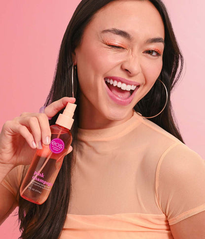 model holding pink champagne body mist