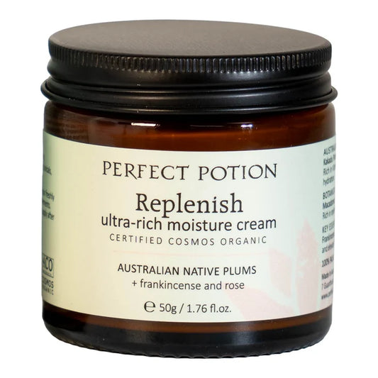 A 50g jar of Perfect Potion Replenish ultra-rich moisture cream, featuring an amber glass jar with a black screw-on lid and a cream-colored label.