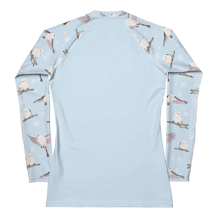 Snow Bird kawaii rash guard in soft pastels with blushing pink cheeks and cherry blossoms