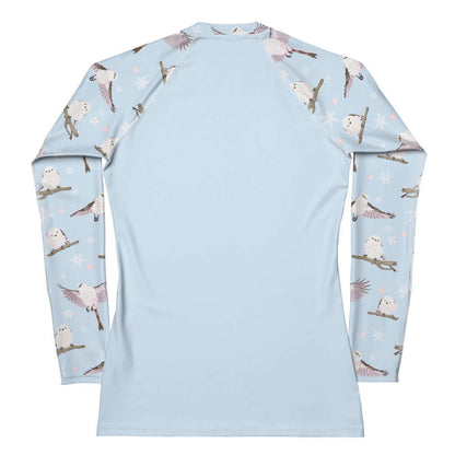 Snow Bird kawaii rash guard in soft pastels with blushing pink cheeks and cherry blossoms