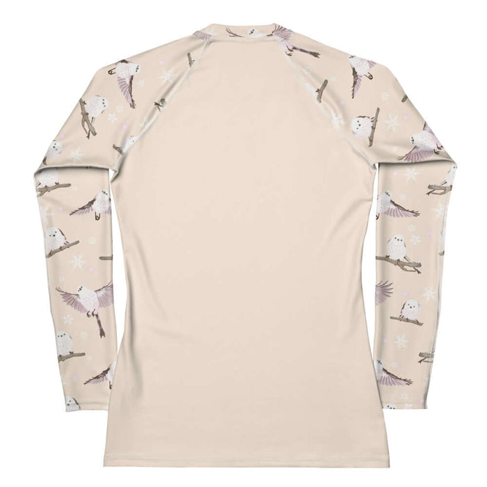 Snow Bird kawaii rash guard in soft pastels with mid-flight birds and falling snow
