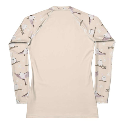 Snow Bird kawaii rash guard in soft pastels with mid-flight birds and falling snow