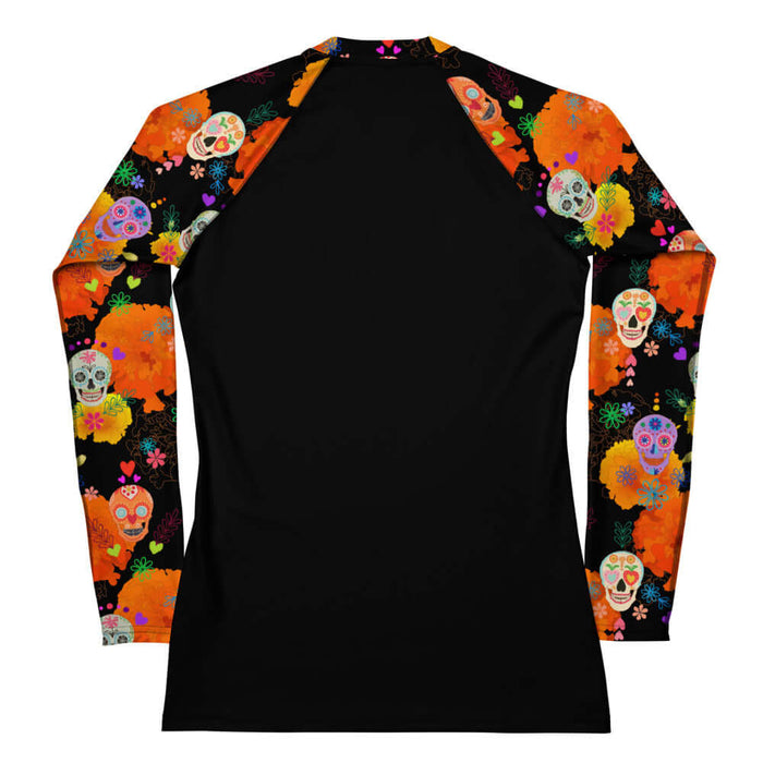 Sugar Skull kawaii rash guard with painted calaveras and cempasúchil blooms on black