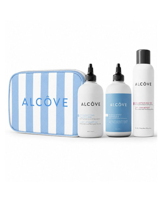 Set of Alcove hair care products including bottles and a striped pouch on a white background