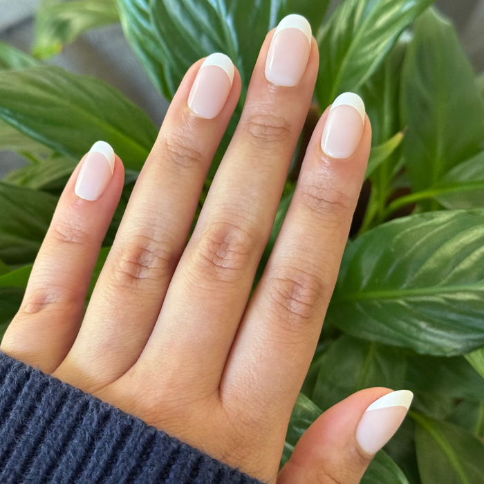 Timeless French - Press-On | Short | Round nails with sheer neutral base and soft milky white tips for an easy at home mani