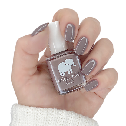 Traveler stoney taupe nail polish manicure on a light skin tone with the bottle