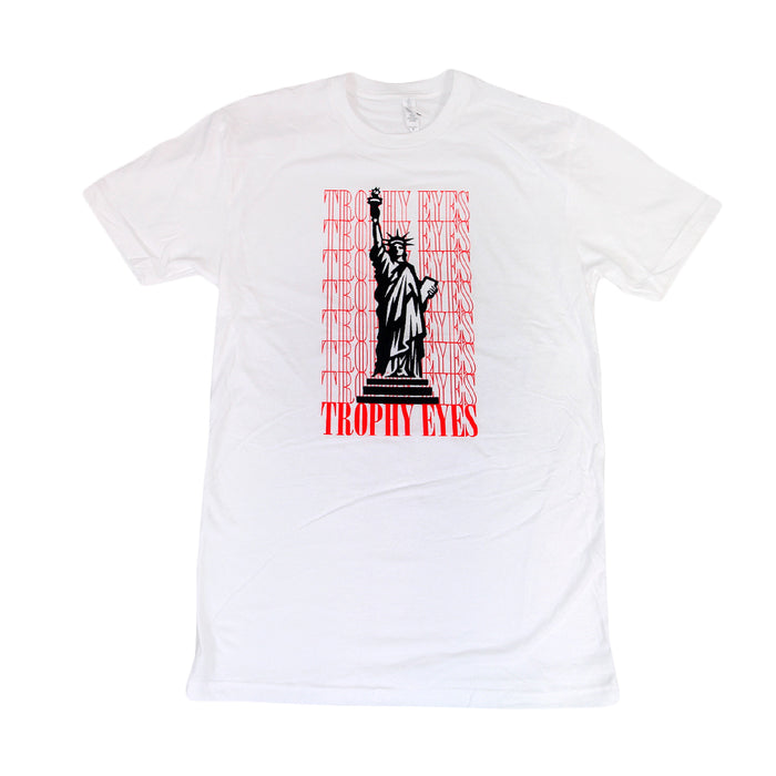 The Trophy Eyes Statue T-shirt features a bold black Statue graphic, repeated red TROPHY EYES text in the background, and a large TROPHY EYES logo at the bottom—a standout style from the Trophy Eyes brand.