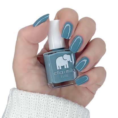 Window Seat muted grey blue nail polish manicure on a light skin tone with the bottle